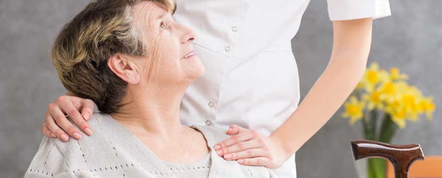 Senior Receiving Personal Care From A Nurse