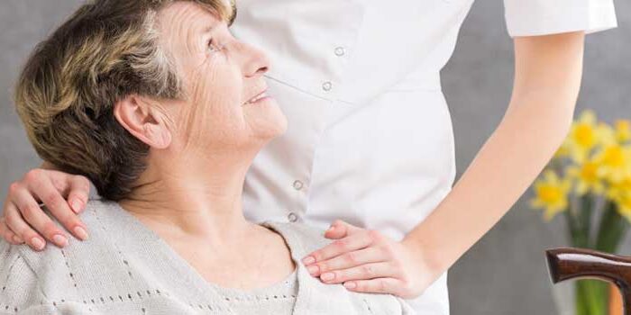 Senior Receiving Personal Care From A Nurse